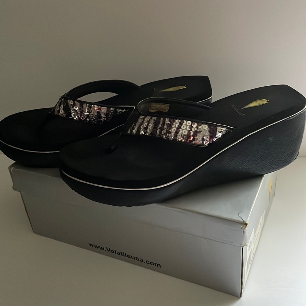 VOLATILE woman’s flip flop wedge, size 10, black with silver sequence, used.